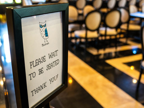 Mochuelo "PLEASE WAIT TO BE SEATED THANK YOU!" sign